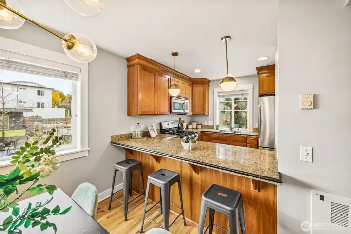 Additional eating space with breakfast bar overlooking kitchen.
