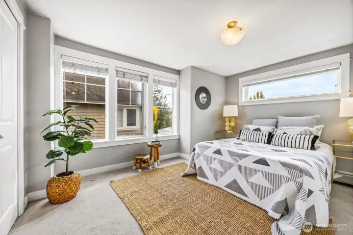 Primary bedrooms flooded with natural light.