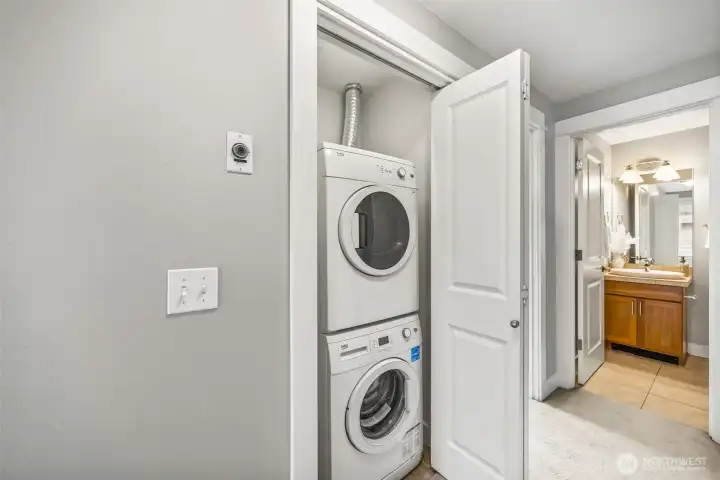 Space-saving stackable washer/dryer for convenience.
