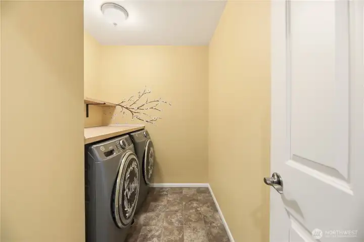Laundry room with added Butcher Block counter space for folding and storage.