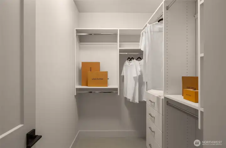 Primary walk-in closet with built-ins.