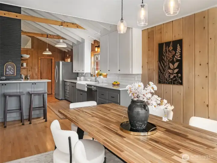 Looking from dining area back through kitchen, pantry door is at the far end of the room.