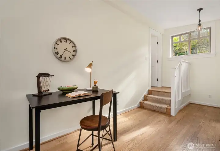 Great spot for a desk or even a love seat in the primary bedroom. En suite bath is up the stairs through the door on left.