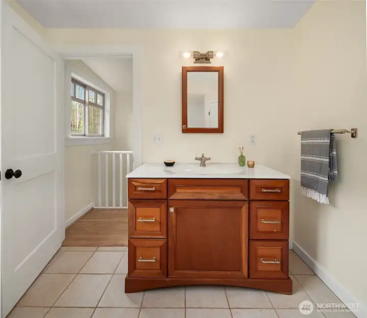 Primary bath vanity. Bedroom is through doorway.