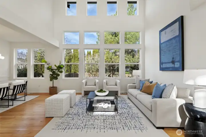 Elegant formal living room with abundant natural light and space for entertaining.