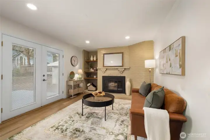 Kitchen opens to the rec room with gas fireplace. French doors leads to expansive trex deck