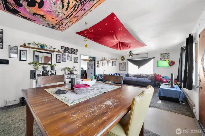 Large cased opening to kitchen.