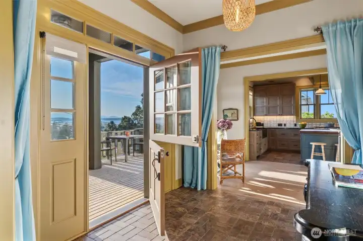 From the moment you step inside, the home reveals its thoughtful design and refined, designer-curated details. The entryway makes an immediate impression, featuring one of three charming Dutch doors on the property. These distinctive doors not only add character but also invite in the refreshing salt air, allowing it to flow naturally through the home and enhance the coastal living experience.