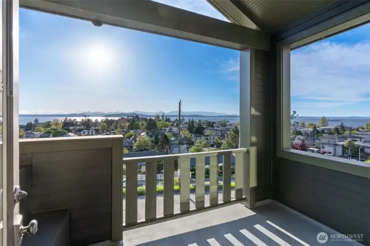 The primary suite, located on the top floor, is ideally positioned to the west with sweeping views toward Puget Sound and the Olympic Mountains. This serene retreat offers a perfect vantage point to take in spectacular sunsets or begin your morning with coffee and a pastry while enjoying the ever-changing light over the water and mountains.