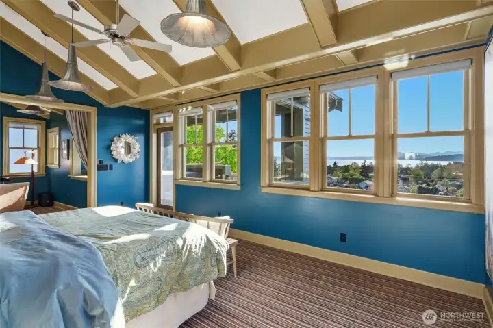 The spacious primary suite offers beautiful western and northern views, both from the sleeping area and the private view deck. Large windows and outdoor access create a serene retreat filled with natural light, where you can take in sweeping vistas and enjoy the ever-changing coastal scenery in complete privacy.