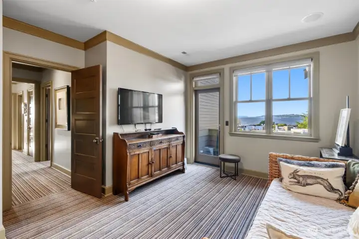 The second of the two guest en-suites offers a comfortable and private retreat, each thoughtfully designed with its own view deck. The closets are well-appointed with integrated lighting and convenient electrical outlets, perfect for charging stick vacuums or powering other small devices.