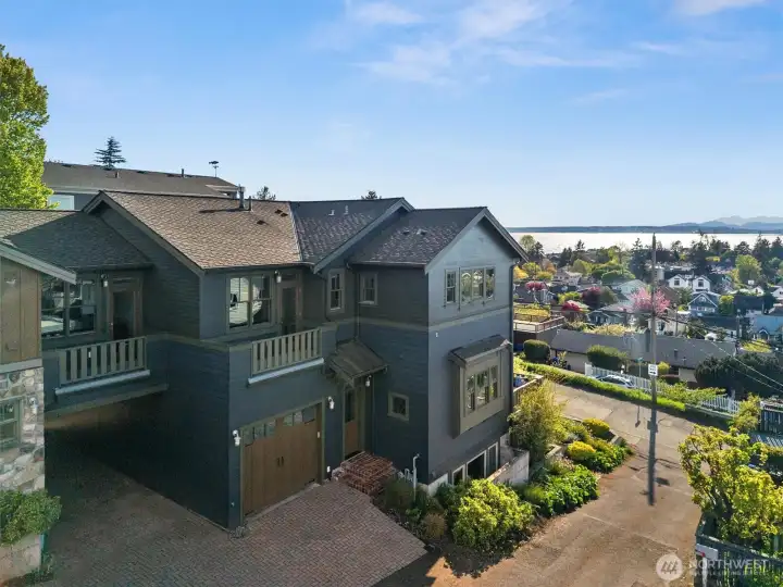 This home features a tandem two-car garage with a mezzanine storage attic and is pre-wired for 220V EV charging. In addition, there is a covered carport large enough for a smaller RV, along with driveway parking for two more vehicles, offering exceptional parking and storage flexibility.