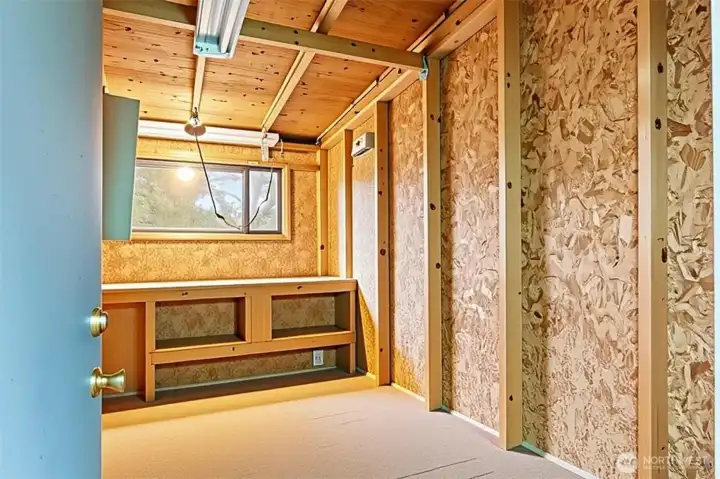 Storage area with power this pictures is staged ( minus items that will be removed prior to closing )