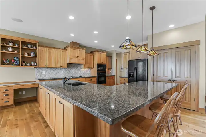 The gourmet kitchen has tons of counterspace including a dining counter.