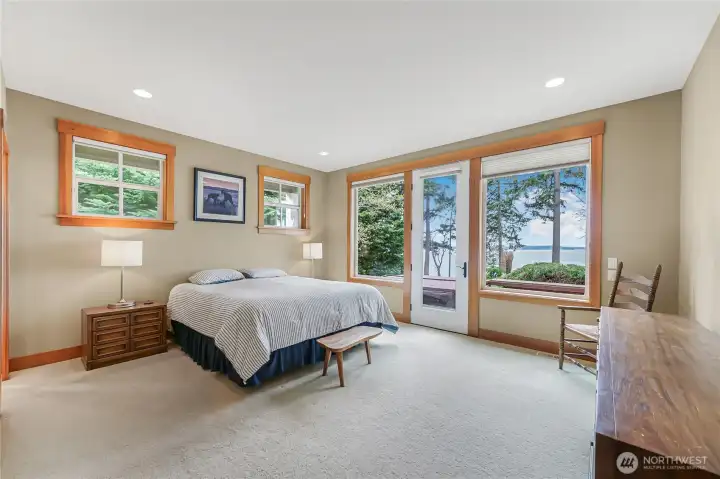 The primary bedroom has direct deck access conveniently located right by the hot tub.