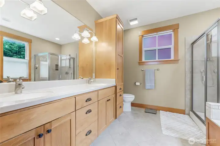 The beautifully appointed 5 piece ensuite in the primary bedroom has ample storage.