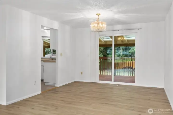 Dining room - Opens to covered deck w skylights for year round enjoyment. Dining room - Opens to covered deck w skylights for year round enjoyment.