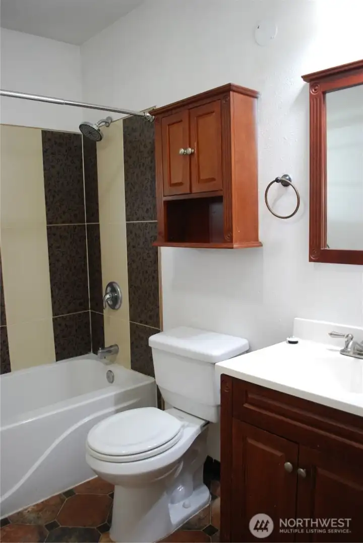 View of the second bathroom and utility room. View of the second bathroom and utility room.