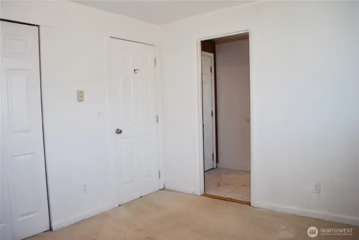 Primary bedroom with access to main bathroom. Primary bedroom with access to main bathroom.