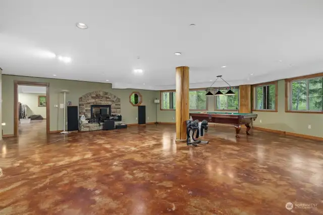 The basement has stained concrete floors and another gas fireplace. These rooms are incredibly large and this was designed to be an ADU or additional living space.
