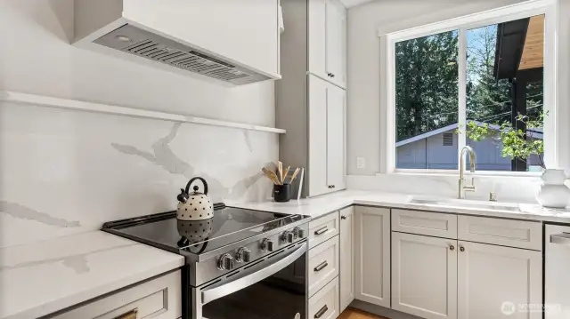 Quartz backsplash and shelving in kitchen