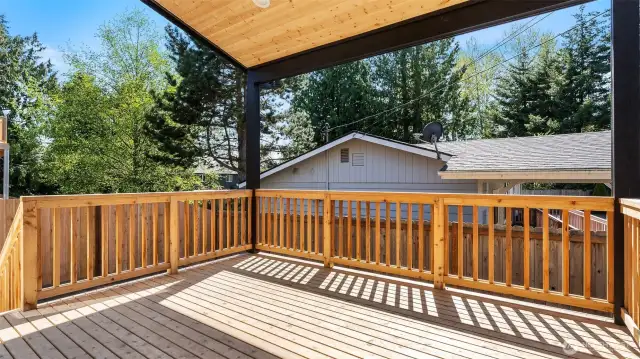 The deck is big and covered for year around enjoyment.