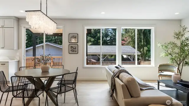 Kitchen eating area with elegant lighting.