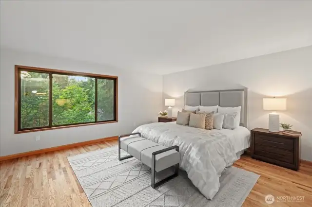 Induldge in the oversized primary bedroom overlooking the quiet backyard - this is truly a retreat!