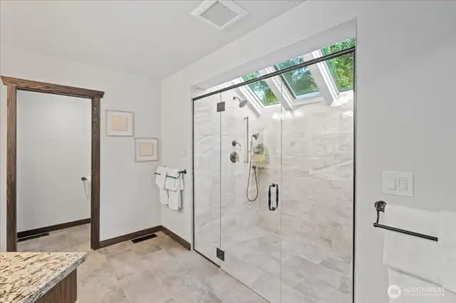 Another view of this custom shower and the separate water closet beyond