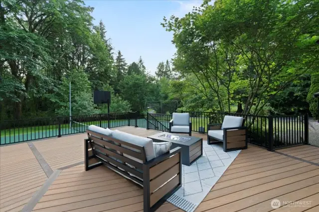 Looking out toward the sport court and the yard beyond. Enjoy the open space or pick your favorite fruit right from your yard including blueberries, apples, quince and pear.