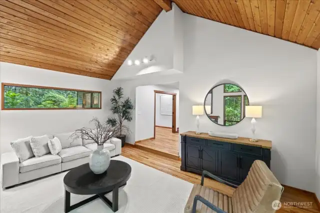You get light from the windows on every wall and will enjoy the natural surroundings on this private lot.