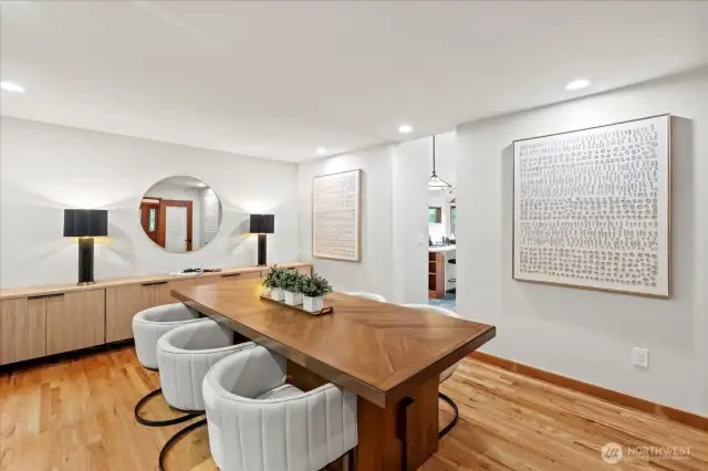 Just through the dining room you will find the kitchen - convenient for meal prep but without having to look at dirty dishes while you are entertaining