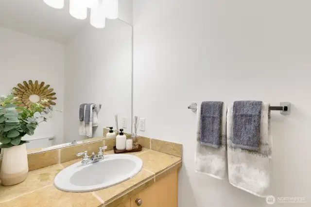 Powder room on main level with new light fixture