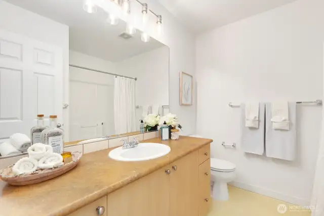 Full guest bathroom with new light fixture