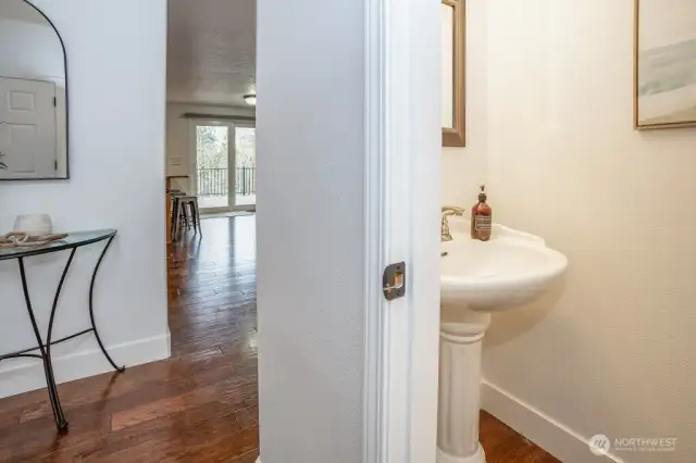 Convenient powder room is centrally located on the main floor.
