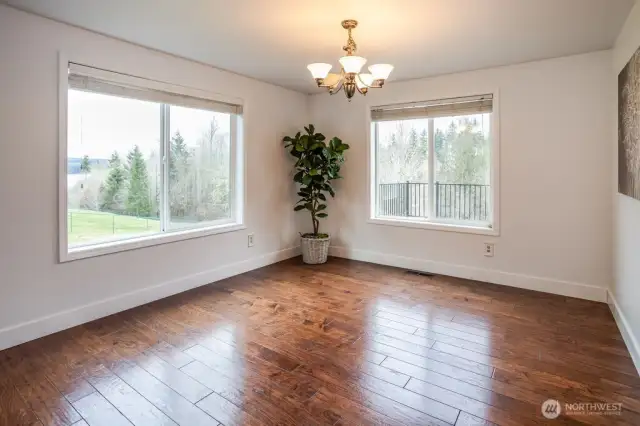 When you choose this home, you get to enjoy time together in the formal dining area with lake and territorial views. The large windows bring in loads of natural light and show off the fresh new paint and trim work.