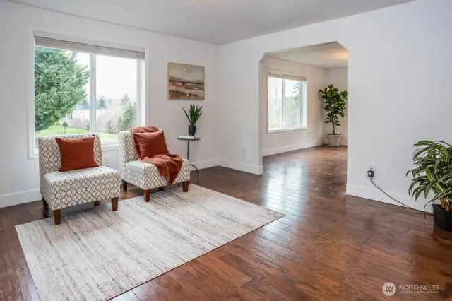 The living room is inviting to say the least. The archway provides a lovely design that adds to the character of the room and a subtle divider between dining and living room.