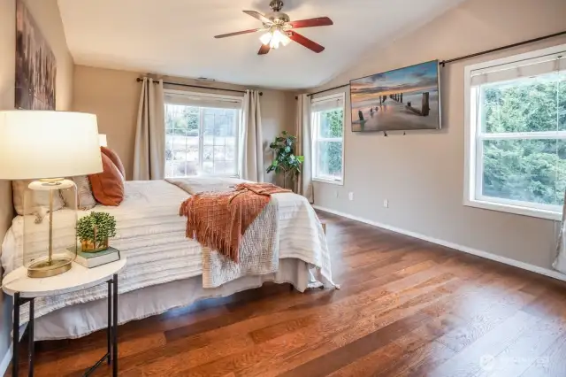 Located on the opposite side of the hallway on the upper floor, you'll find a private primary suite to call your own. Wake up every day to incredible lake and territorial views!