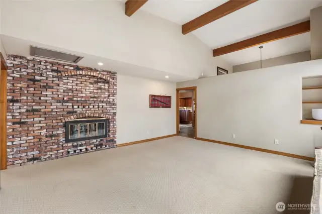 Double sided fireplace and large room for easy entertaining and built in shelves and window seat.