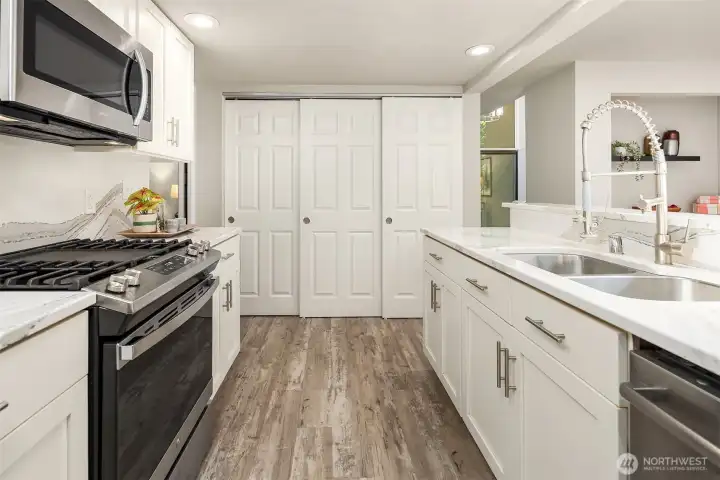 Large pantry storage area at the end of the kitchen. The washer and dryer could also be moved here as it is already plumbed.