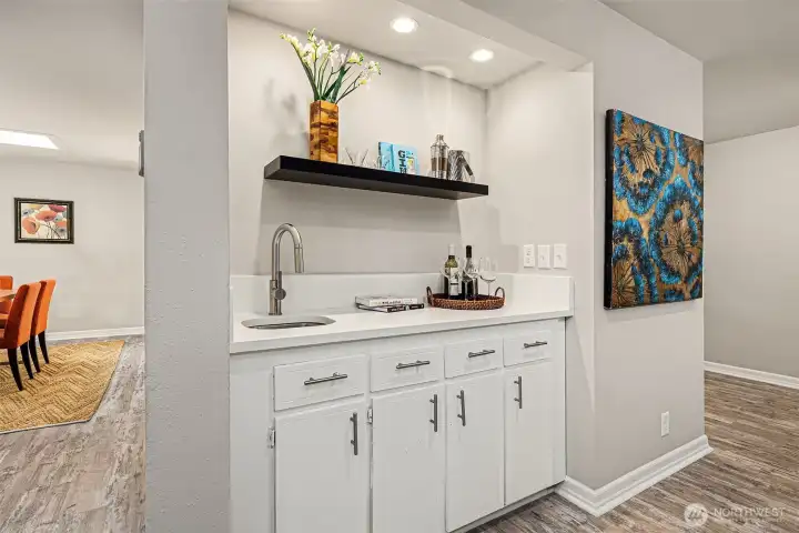 Wet bar located in formal dining area which is currently staged as an office.