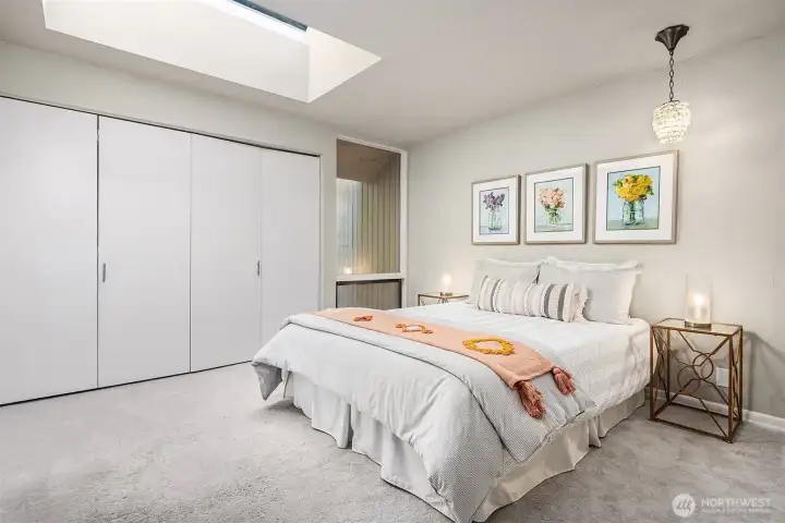 Second main level bedroom. Skylights are found throughout this home.