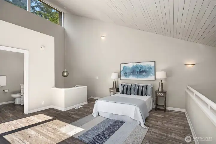 Upper level loft can be used as a bedroom, den or simply flex space.