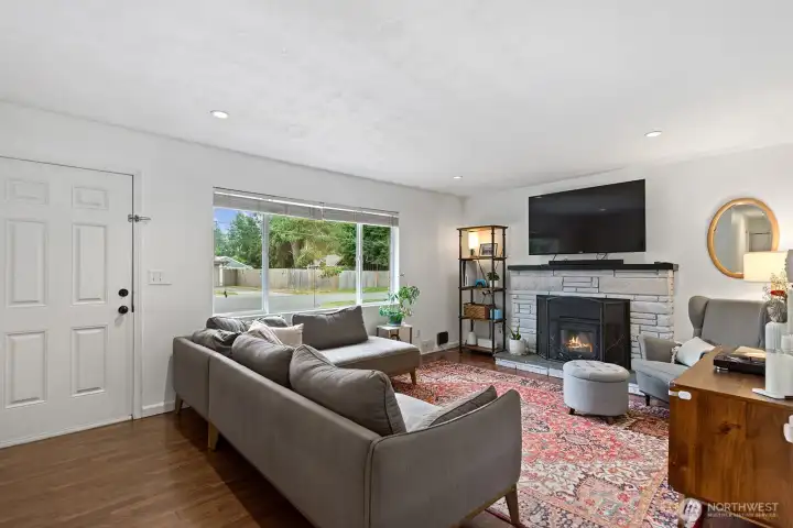 The bright and spacious living room has plenty of space for a large couch and extra furniture.