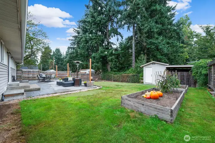The rear yard has so much room to play, garden, and entertain.