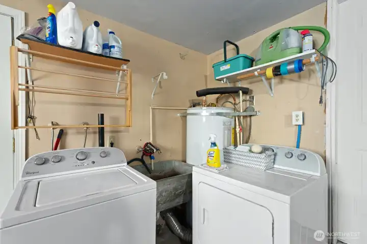 The laundry is located at the end of the garage.