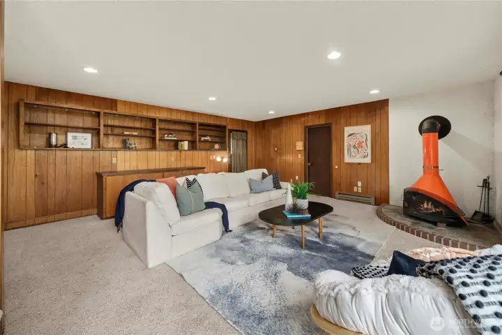 Cozy up in the second living area with a stunning wood fireplace as the centerpiece