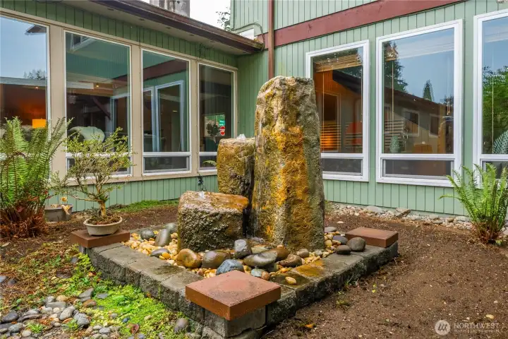 Serene water feature visible from multiple rooms—bringing tranquility indoors