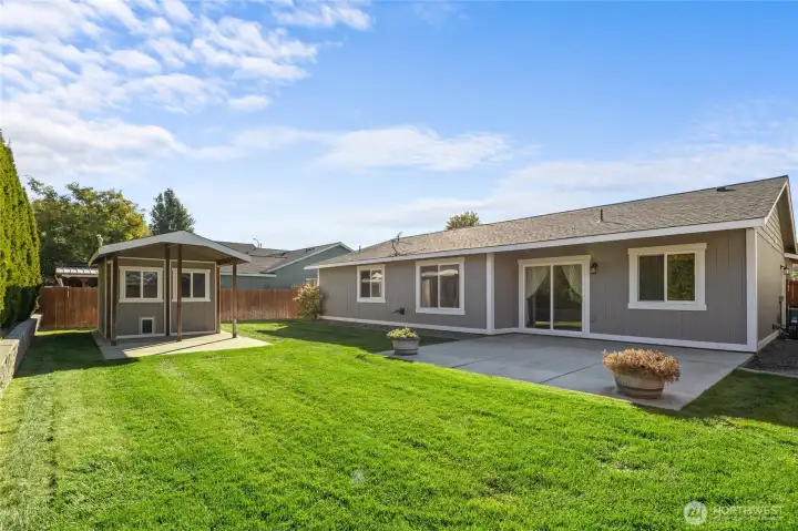 The fully fenced and landscaped backyard is perfect for outdoor living!