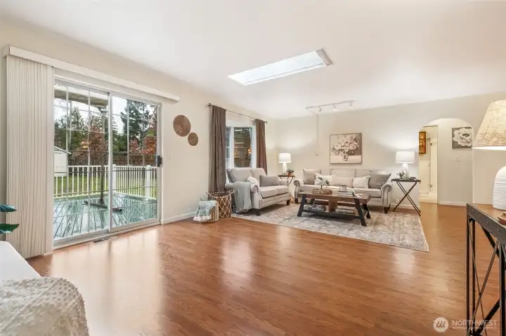 Offering an airy sense of openness, this living space blends comfort with versatility. The spacious main room invites a wide range of seating layouts and functional uses.